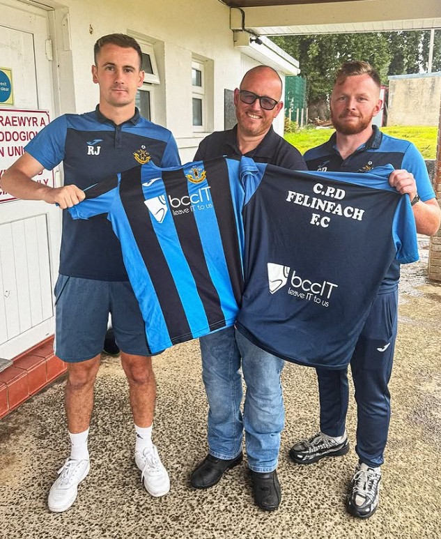 CPDFelinfach football team with BCC IT Acounts Manager Leon Kedwood Jones holding team shirts featuring the BccIt logo.